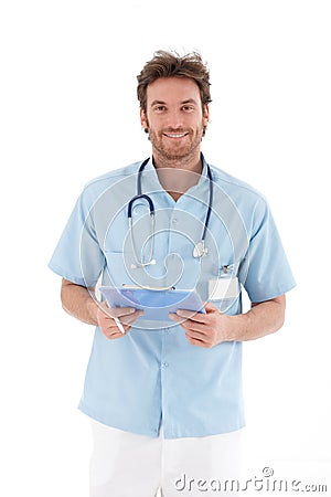 Goodlooking doctor smiling at camera Stock Photo