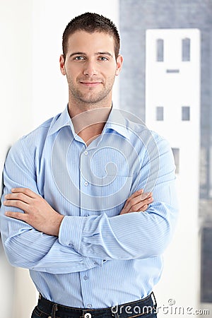 Goodlooking man smiling confidently Stock Photo