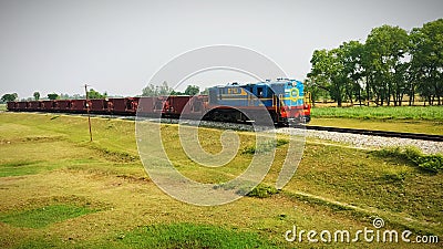 A goods train in a village with buetifull wether Editorial Stock Photo