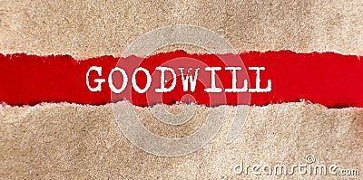Goodwill text appearing behind on torn paper Stock Photo