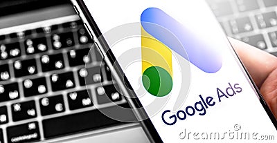 Google Ads symbol on the screen smartphone and notebook background Editorial Stock Photo