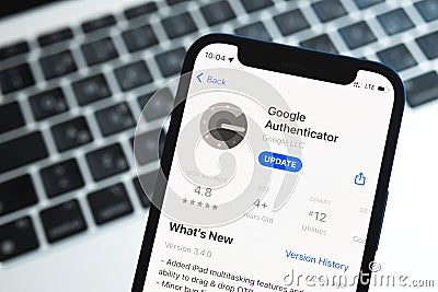 Google Authenticator application, icon close-up. Mobile phone with security application Editorial Stock Photo