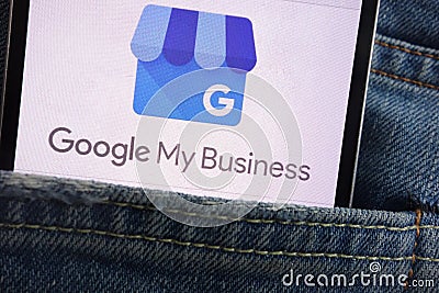 Google My Business logo displayed on smartphone hidden in jeans pocket Editorial Stock Photo