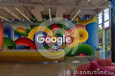 Google sign on the wall behind the reception desk at the Google headquarters in Silicon Valley Editorial Stock Photo