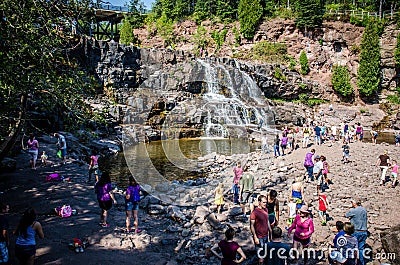 Gooseberry Falls, a popular waterfall near Lake Superior, attracts a crowd of visitors on a Editorial Stock Photo