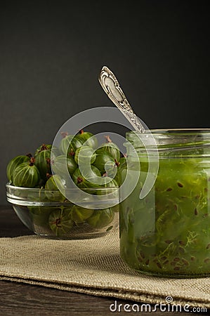 Gooseberry smoothie in a jar on a brown table Stock Photo