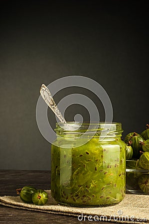 Gooseberry smoothie in a jar on a white table Stock Photo