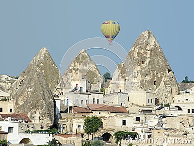 Goreme Village, Fairy Chimneys and Balloon Stock Photo