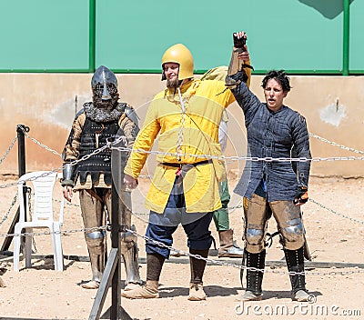 The judge in the ring announces the winner in the fight at the knight festival in Goren park in Israel Editorial Stock Photo