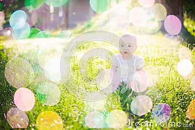 Gorgeous baby girl on a sunny meadow portrait Stock Photo