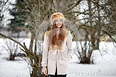 Gorgeous beautiful russian woman in winter park Stock Photo