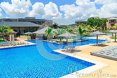 Gorgeous beautiful view of swimming pool, tranquil turquoise azure water and tropical garden Editorial Stock Photo