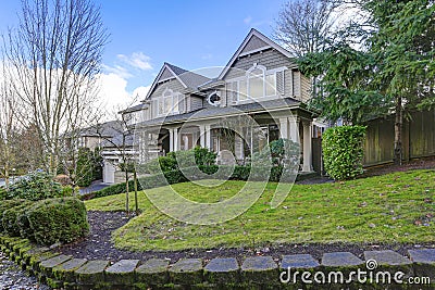 Gorgeous big Craftsman home with gray wood exterior Stock Photo