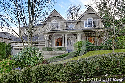 Gorgeous big Craftsman home with gray wood exterior Stock Photo