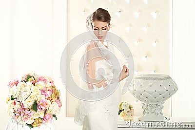 Gorgeous bride in a white room Stock Photo
