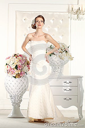 Gorgeous bride in a white room Stock Photo