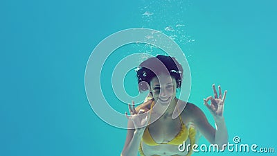 gorgeous brunette yellow bikini swimming underwater slow motion 43397998