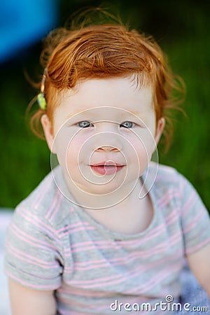 Gorgeous cute red haired little girl Stock Photo