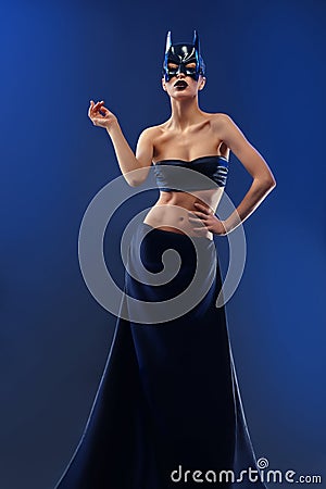 Gorgeous female fashion model wearing top and long black skirt Stock Photo