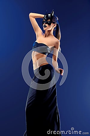 Gorgeous female fashion model wearing top and long black skirt Stock Photo