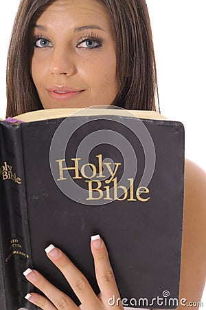 Gorgeous girl reading the bible Stock Photo