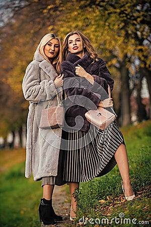 Gorgeous girls. Beauty and fashion concept. Difference between faux and real fur. Visual aesthetics. Benefits wearing Stock Photo
