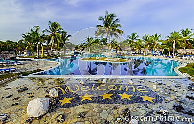 Gorgeous inviting view of luxury swimming pool and hotel grounds in tropical garden Editorial Stock Photo