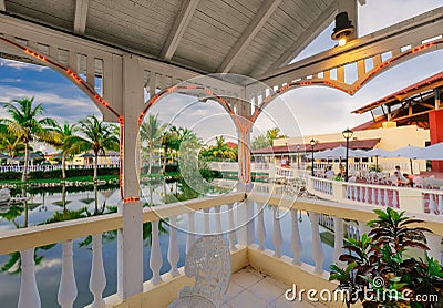 Gorgeous inviting view of resort grounds from the inside of gazebo in tropical garden at sunset time Editorial Stock Photo