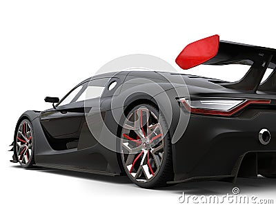 Gorgeous matte black super car with red details on the wheels and rear wing Stock Photo