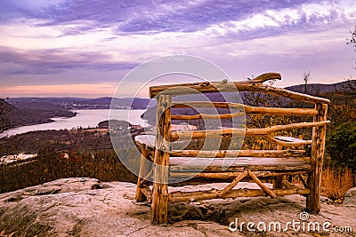 Gorgeous mountain and sunset landscape with wooden bench Stock Photo