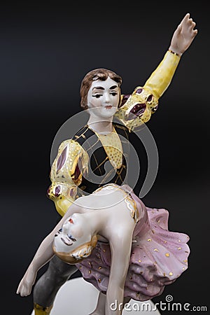 Gorgeous old figurine of a ballerina and her partner performing the adagio (slow part of the dance). Stock Photo