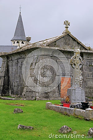 Gorgeous old graveyard vault and Celtic cross in old cemetery,Ireland,2014 Editorial Stock Photo