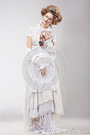 Gorgeous Outre Female in Lacy White Dress with Flowers Stock Photo