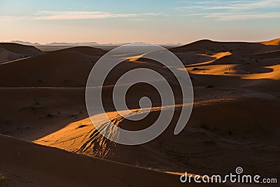 Gorgeous and scenic desert sunset scene above beautiful sand dunes Erg Chebbi, Morocco, Merzouga Stock Photo