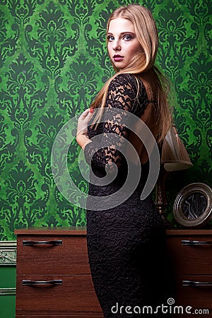 Gorgeous sensual girl in black dress with naked back Stock Photo