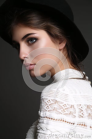 Gorgeous sensual woman with dark straight hair wears elegant dress Stock Photo