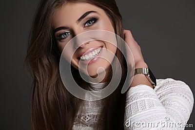 Gorgeous sensual woman with dark straight hair wears elegant dress Stock Photo