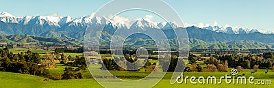 The gTararua Ranges in the Wairarapa with snow on the peaks and the lush rural agricultural valley below Stock Photo