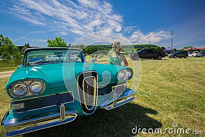 Gorgeous view of old vintage classic car with pretty smiled little girl standing beside Editorial Stock Photo