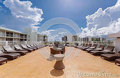 gorgeous view of various modern stylish outdoor patio furniture with sunbeds Editorial Stock Photo