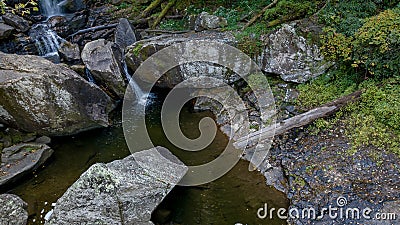 A Gorgeous Waerfalls Flows In A Mountain Envrionment Stock Photo