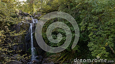 A Gorgeous Waerfalls Flows In A Mountain Envrionment Stock Photo