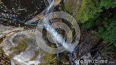 A Gorgeous Waerfalls Flows In A Mountain Envrionment Stock Photo