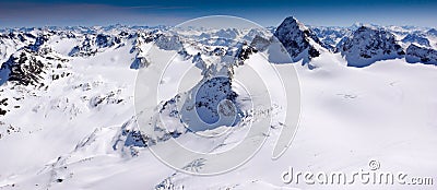 Gorgeous winter mountain landscape with the famous Piz Buin and a glacier in the Swiss Alps Stock Photo