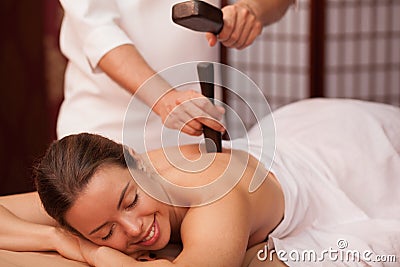 Young woman enjoying professional thai massage Stock Photo