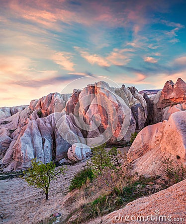 Gorgeous world of Cappadocia. Picturesque spring sunset in Red Rose valley in April. Cavusin village located, district of Avanos Stock Photo