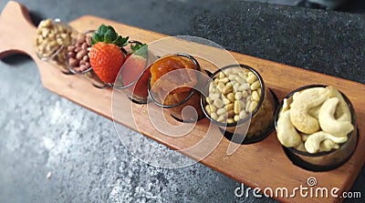 Gorgeous World of Nuts and Strawberry Stock Photo