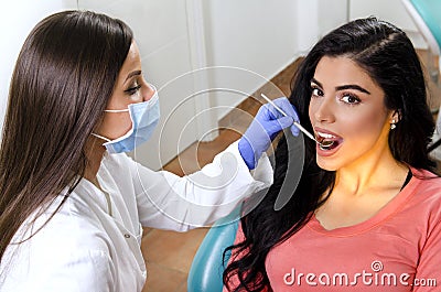 Gorgeous young adult woman, dental checkup Stock Photo
