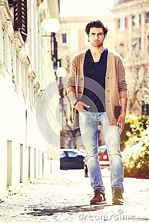 Gorgeous young men italian model outdoors, urban scene in the city Stock Photo