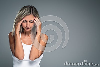 Gorgeous young woman with severe headache/migraine/depression Stock Photo